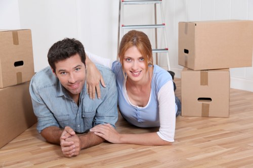 Professional movers handling furniture during a Leavesgreen relocation