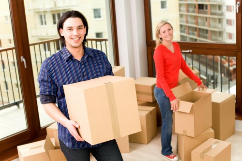Fragile items being wrapped and boxed during a packing service